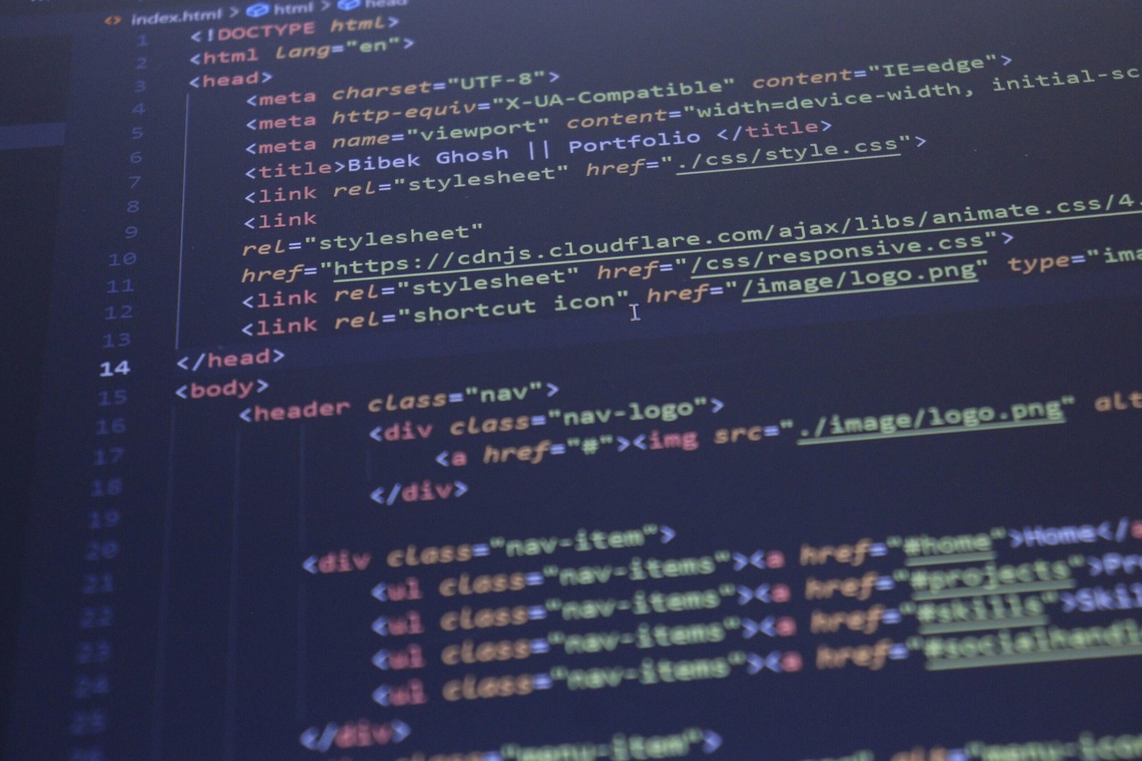 Close-up view of HTML and CSS code displayed on a computer screen, ideal for programming and technology themes.